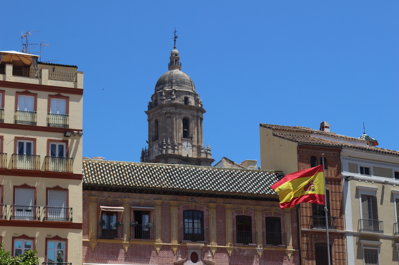 Building with a flag of Spain on a flag pole